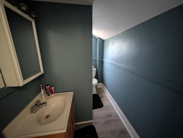 1236 Fulton Ave, Grand Haven, MI 49417 - half bath featuring vanity and wood finished floors