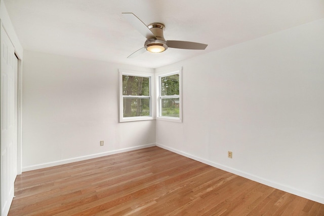 105 S Emerson Lake Rd, Branch, MI 49402 - spare room featuring light wood-style flooring and a ceiling fan