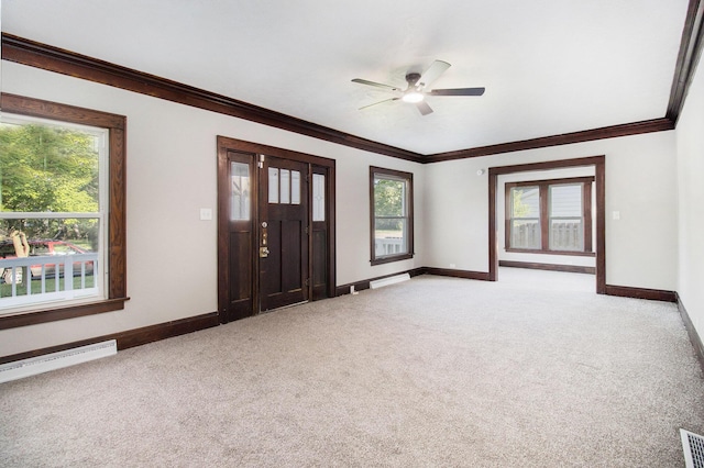 11 S Broad St, Battle Creek, MI 49017 - foyer featuring light carpet, crown molding, ceiling fan, and a baseboard heating unit