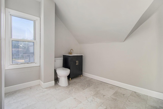 11 S Broad St, Battle Creek, MI 49017 - bathroom featuring lofted ceiling and marble look tiles