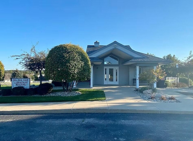 4232 Limousin Ct SW, Grandville, MI 49418 - view of front of property with french doors and a chimney