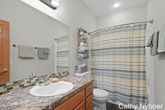 4232 Limousin Ct SW, Grandville, MI 49418 - full bath featuring vanity, shower / tub combo with curtain, and backsplash