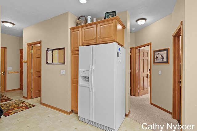 4232 Limousin Ct SW, Grandville, MI 49418 - kitchen with white refrigerator with ice dispenser and light floors