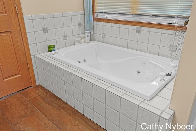 4232 Limousin Ct SW, Grandville, MI 49418 - bathroom with a tub with jets and wood finished floors