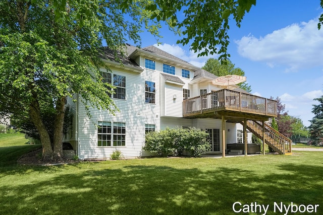 4232 Limousin Ct SW, Grandville, MI 49418 - rear view of house featuring a wooden deck, a yard, and stairs