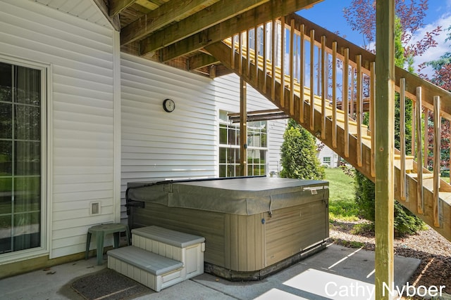 4232 Limousin Ct SW, Grandville, MI 49418 - view of patio / terrace featuring a hot tub and stairway