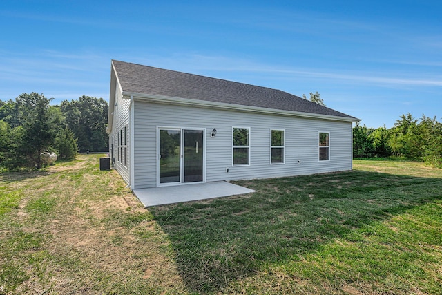 57860 James Dr, Three Rivers, MI 49093 - back of house with a lawn and a patio area