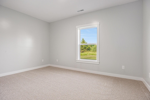 57860 James Dr, Three Rivers, MI 49093 - spare room featuring light colored carpet and baseboards