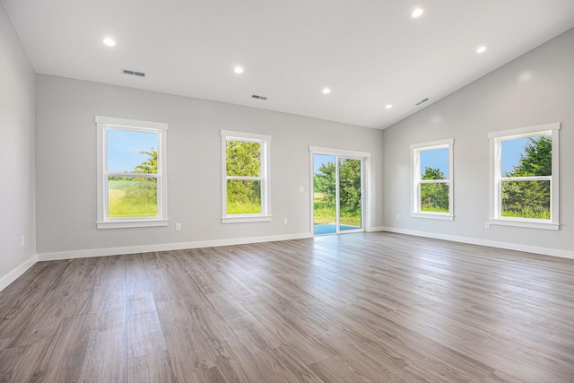 57860 James Dr, Three Rivers, MI 49093 - unfurnished room featuring vaulted ceiling, wood finished floors, and recessed lighting