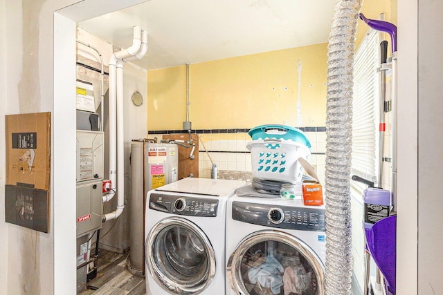 46555 Maben Rd, Canton, MI 48187 - laundry area featuring washer and clothes dryer, water heater, and wood finished floors