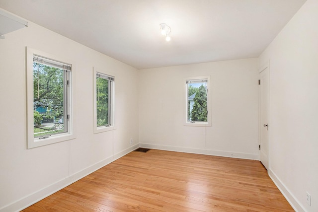 2425 University Ave, Kalamazoo, MI 49008 - unfurnished room with light wood-style flooring and baseboards