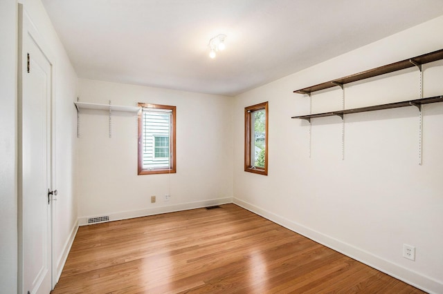 2425 University Ave, Kalamazoo, MI 49008 - unfurnished bedroom featuring light wood-style flooring and baseboards
