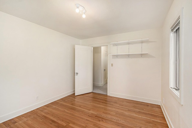 2425 University Ave, Kalamazoo, MI 49008 - unfurnished bedroom with light wood finished floors and baseboards