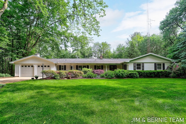 8518 146th Ave, West Olive, MI 49460 - ranch-style house featuring a chimney, a garage, concrete driveway, and a front lawn