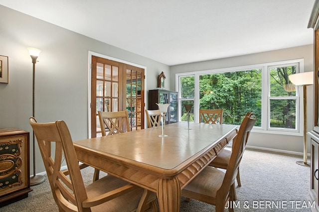 8518 146th Ave, West Olive, MI 49460 - carpeted dining area with baseboards and french doors