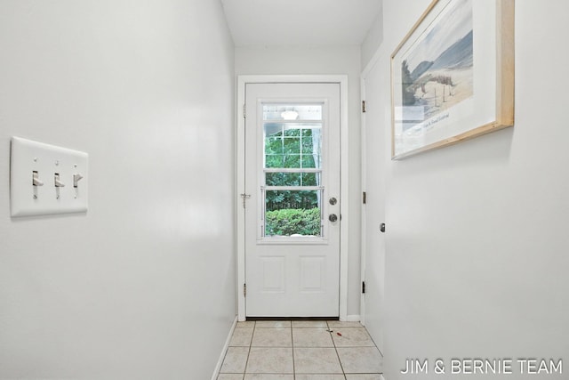 8518 146th Ave, West Olive, MI 49460 - doorway to outside with baseboards and light tile patterned flooring