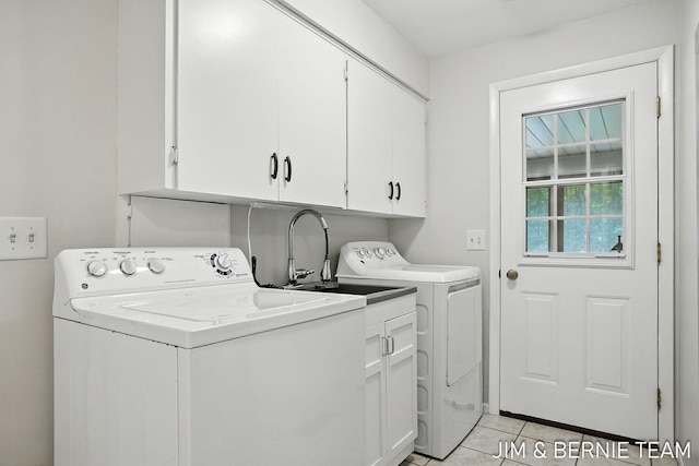 8518 146th Ave, West Olive, MI 49460 - laundry room with independent washer and dryer, cabinet space, and light tile patterned flooring