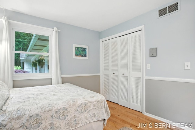 8518 146th Ave, West Olive, MI 49460 - bedroom featuring wood finished floors and a closet