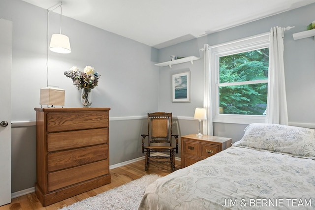 8518 146th Ave, West Olive, MI 49460 - bedroom with wood finished floors and baseboards