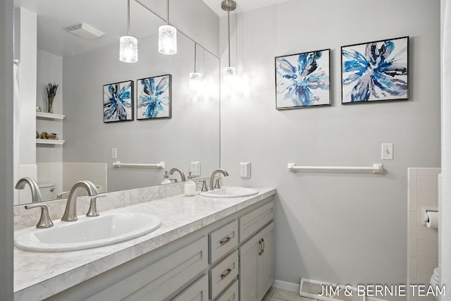 8518 146th Ave, West Olive, MI 49460 - full bath with double vanity and tile patterned flooring