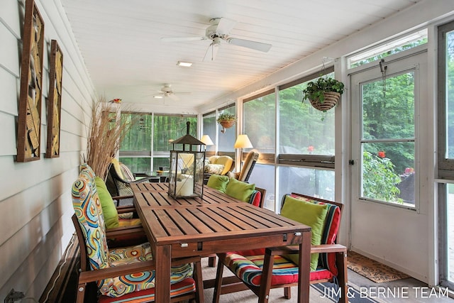 8518 146th Ave, West Olive, MI 49460 - sunroom with a ceiling fan and outdoor dining space