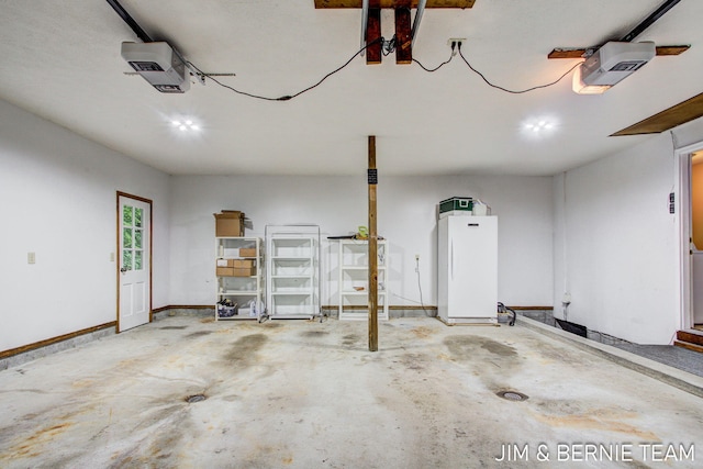 8518 146th Ave, West Olive, MI 49460 - garage featuring a garage door opener