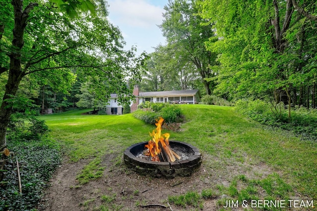 8518 146th Ave, West Olive, MI 49460 - view of green lawn featuring an outdoor fire pit