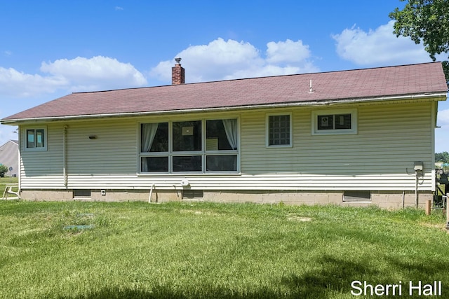 11956 Berrigan Ave NE, Cedar Springs, MI 49319 - back of house featuring a chimney, a yard, and a shingled roof