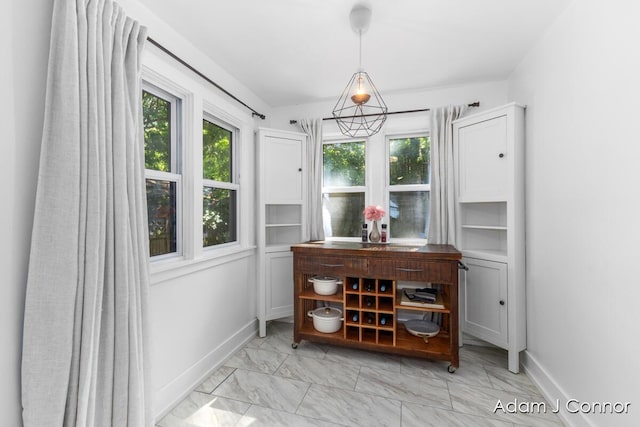 1516 Colorado Ave SE, Grand Rapids, MI 49507 - dining area with light marble finish flooring and healthy amount of natural light