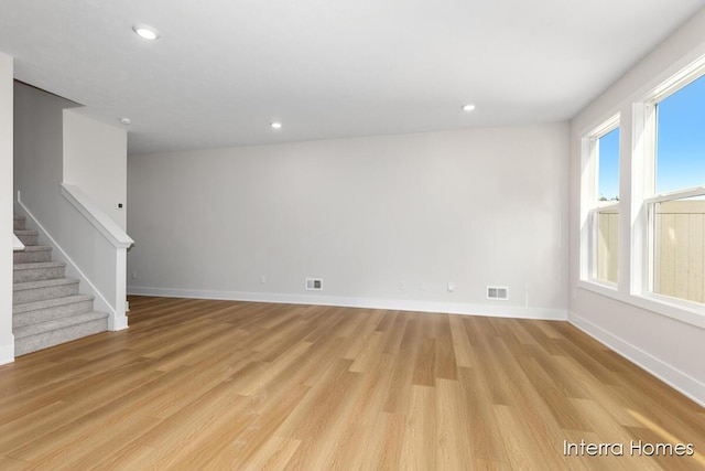 3345 Kings River St SW Unit 38, Wyoming, MI 49418 - spare room featuring light wood finished floors, plenty of natural light, stairway, and recessed lighting