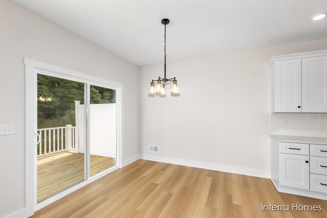 3345 Kings River St SW Unit 38, Wyoming, MI 49418 - unfurnished dining area with light wood-style floors, a chandelier, and recessed lighting