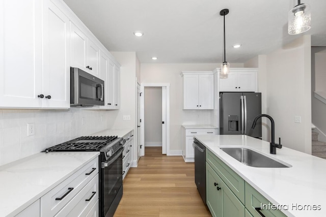 3345 Kings River St SW Unit 38, Wyoming, MI 49418 - kitchen with appliances with stainless steel finishes, white cabinetry, light wood-style floors, and recessed lighting