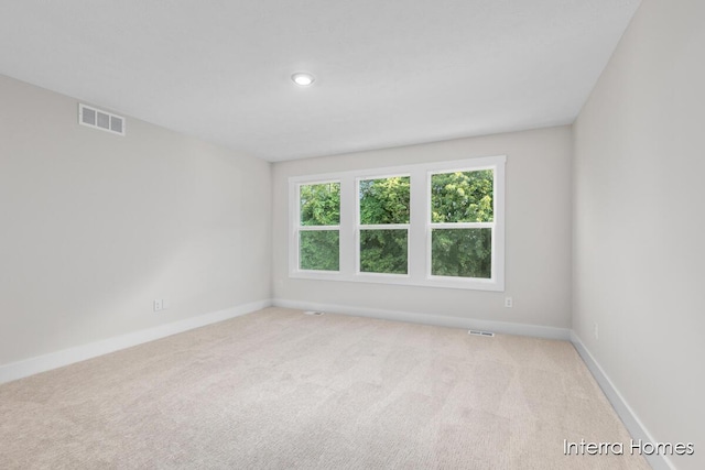 3345 Kings River St SW Unit 38, Wyoming, MI 49418 - unfurnished room featuring light colored carpet and recessed lighting