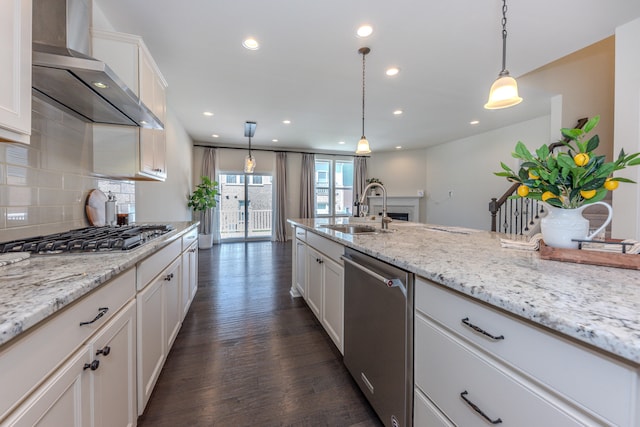 2763 Polson St, Ann Arbor, MI 48105 - kitchen featuring appliances with stainless steel finishes, wall chimney range hood, recessed lighting, dark wood-style flooring, and decorative backsplash