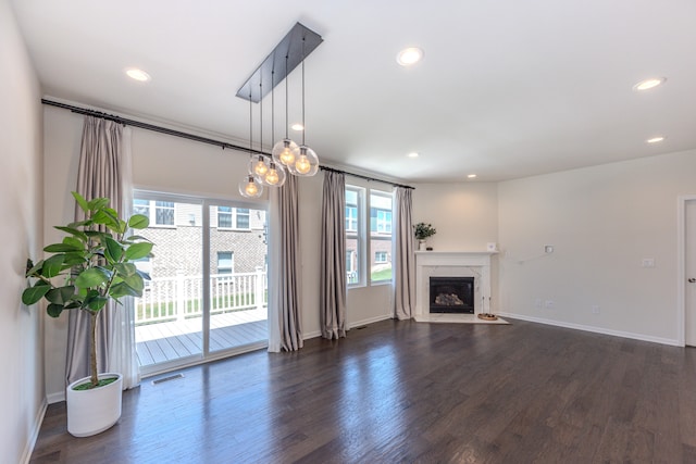2763 Polson St, Ann Arbor, MI 48105 - unfurnished living room with dark wood-style flooring, recessed lighting, and a fireplace