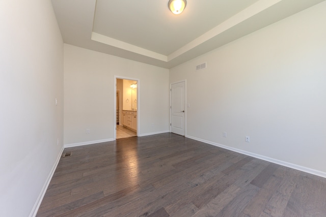 2763 Polson St, Ann Arbor, MI 48105 - unfurnished room with dark wood finished floors and a tray ceiling