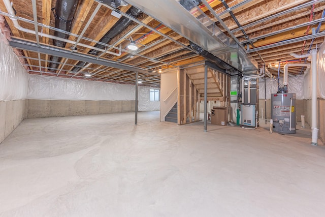 2763 Polson St, Ann Arbor, MI 48105 - unfinished below grade area with gas water heater, stairs, and heating unit