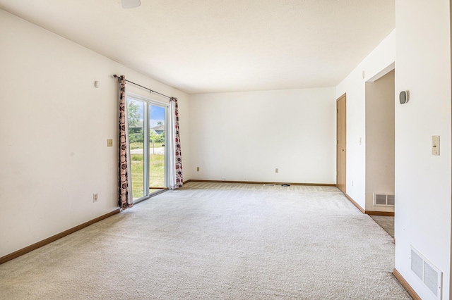 885 Broadway, Benton Harbor, MI 49022 - carpeted spare room with baseboards