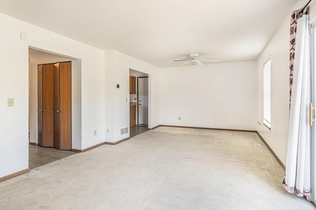 885 Broadway, Benton Harbor, MI 49022 - carpeted empty room featuring a ceiling fan and baseboards