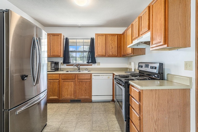 885 Broadway, Benton Harbor, MI 49022 - kitchen featuring freestanding refrigerator, dishwasher, under cabinet range hood, electric range, and light countertops