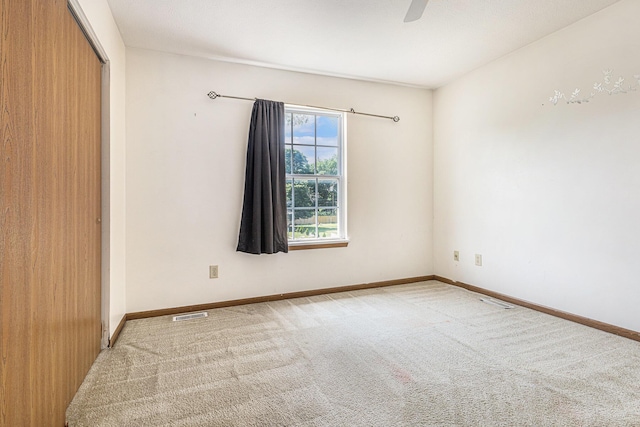 885 Broadway, Benton Harbor, MI 49022 - carpeted empty room featuring baseboards and ceiling fan