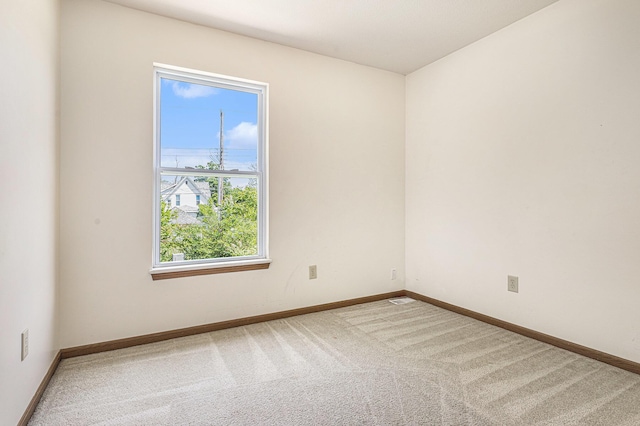 885 Broadway, Benton Harbor, MI 49022 - unfurnished room with carpet flooring and baseboards