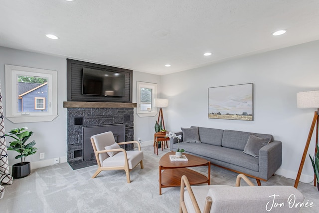 6116 Eastern Ave SE, Grand Rapids, MI 49508 - carpeted living area featuring a large fireplace, healthy amount of natural light, and recessed lighting