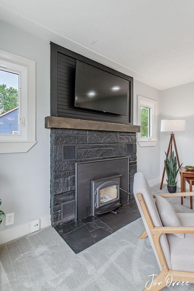 6116 Eastern Ave SE, Grand Rapids, MI 49508 - detailed view of carpet flooring and a stone fireplace
