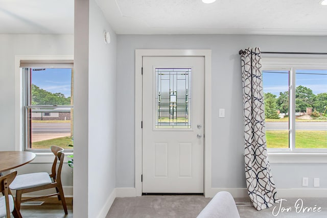 6116 Eastern Ave SE, Grand Rapids, MI 49508 - entryway with baseboards and carpet floors