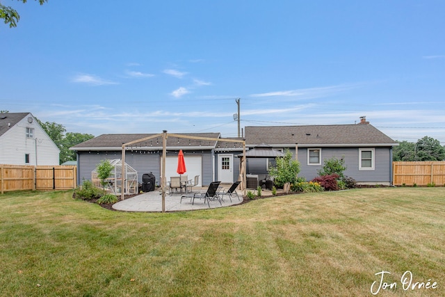 6116 Eastern Ave SE, Grand Rapids, MI 49508 - back of property with a gazebo, a patio area, and a fenced backyard