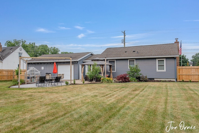 6116 Eastern Ave SE, Grand Rapids, MI 49508 - rear view of house with a gazebo, a patio area, and roof with shingles