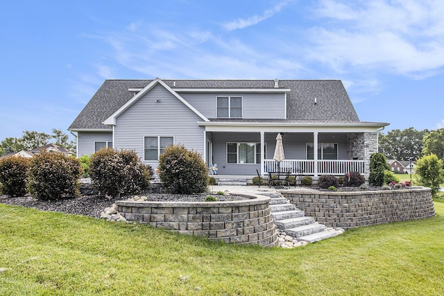 46140 Finch St, Mattawan, MI 49071 - view of front of house with a front yard, covered porch, and a shingled roof