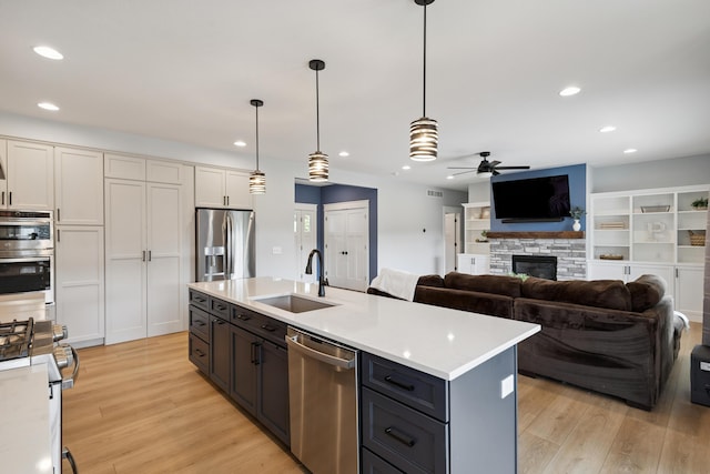 46140 Finch St, Mattawan, MI 49071 - kitchen with stainless steel appliances, ceiling fan, light wood-style floors, light countertops, and recessed lighting
