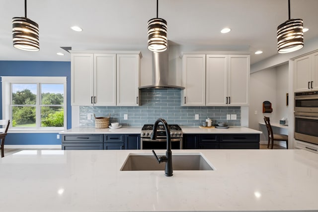 46140 Finch St, Mattawan, MI 49071 - kitchen with double oven, decorative backsplash, white cabinetry, light stone countertops, and recessed lighting